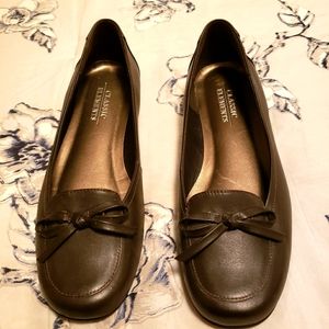 Brown flats with small heel. Leather upper. Never worn.